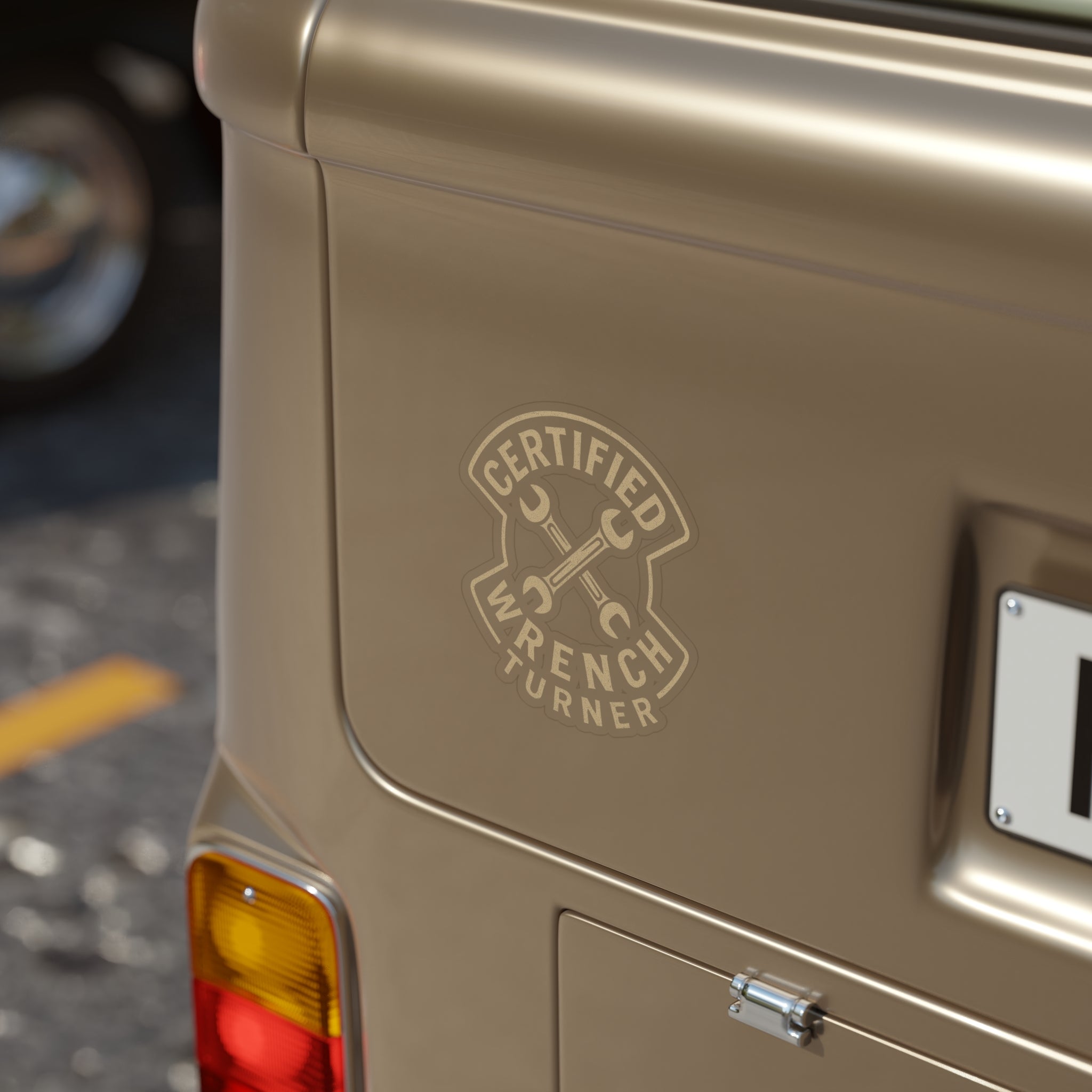 Beige vehicle with 'Certified Wrench Turner' logo on the back